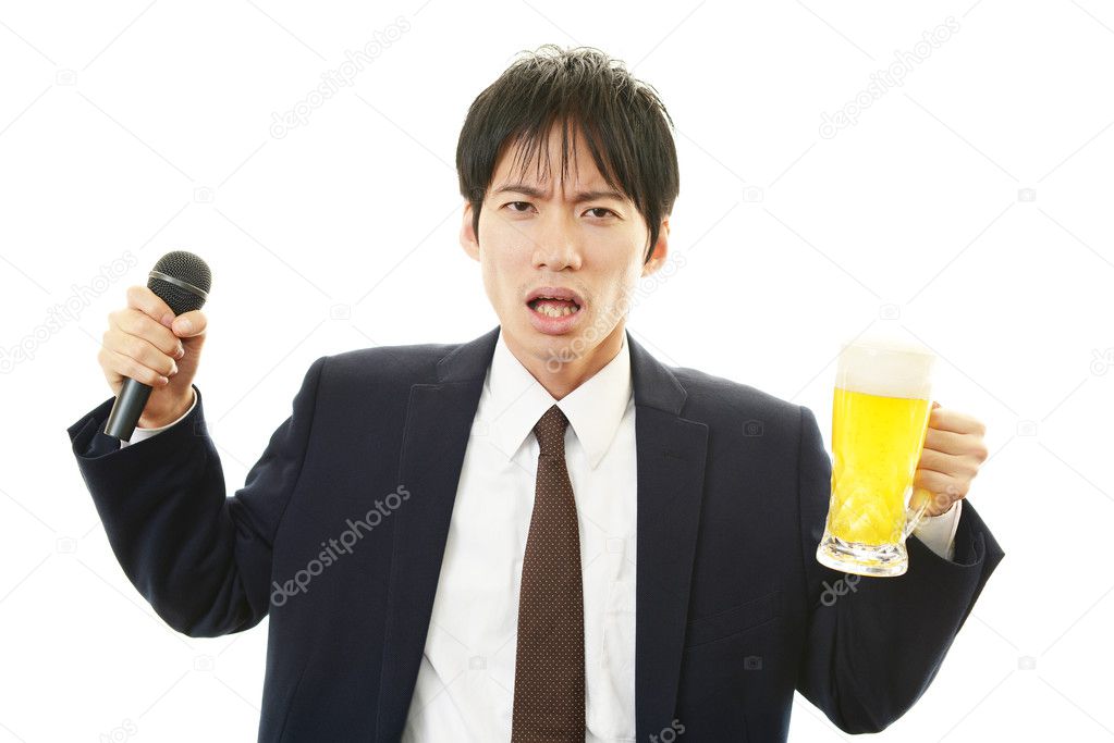 Portrait of handsome man drinking beer