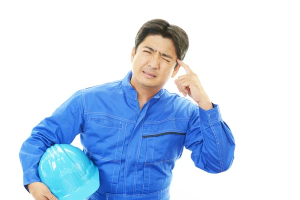 Tired and stressed Asian worker — Stock Photo, Image