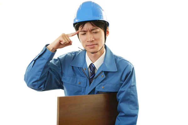 Tired and stressed Asian worker — Stock Photo, Image
