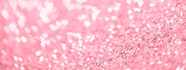Valentijnsdag web banner of roze sparkle achtergrond met glinsterende harten bokeh. — Stockfoto