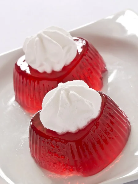 Red jello with cream — Stock Photo, Image