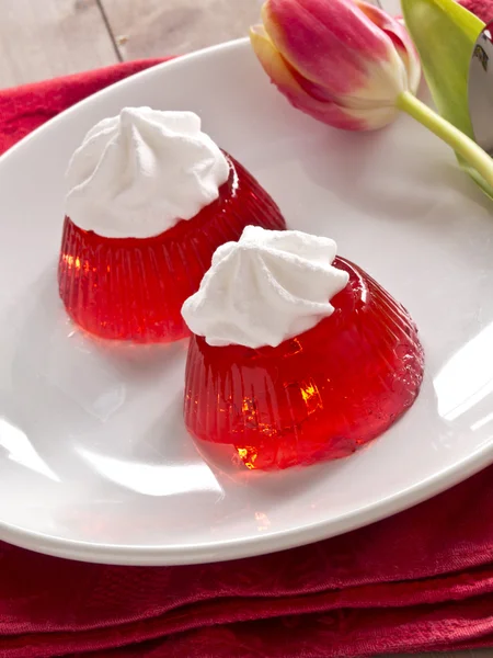 Red jello with cream — Stock Photo, Image