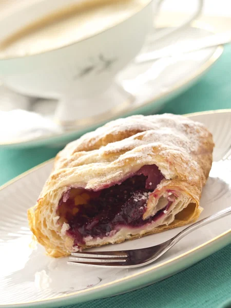 A piece of cherry cake and a cup of coffee — Stock Photo, Image