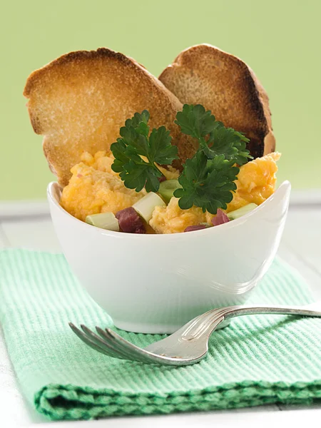 Scrambled eggs with onions and ham — Stock Photo, Image