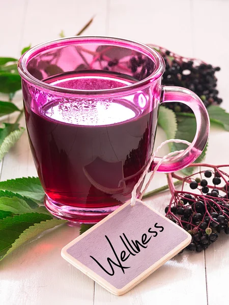 Fruit tea with elderberry berries and leaves — Stock Photo, Image