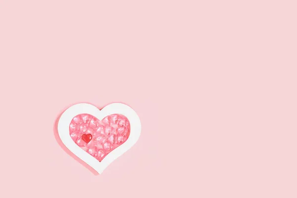 Valentines Day Pink Background Many Glass Hearts White Heart Frame — Zdjęcie stockowe