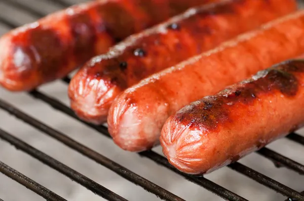 Hot dogs grilling — Stock Photo, Image