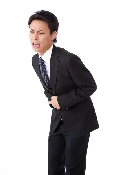 Jonge zakenman abdominale pijn lijden — Stockfoto