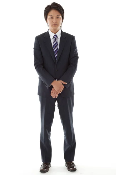 Standing young businessman — Stock Photo, Image