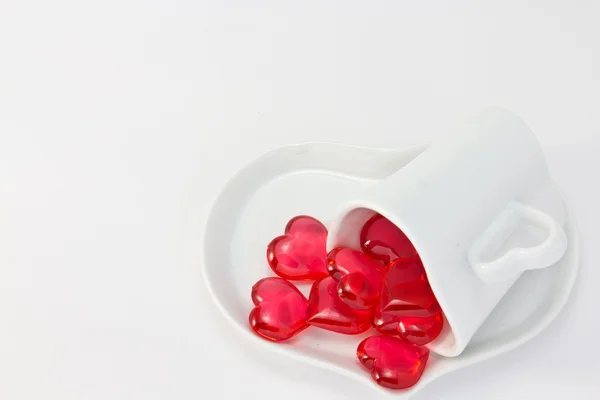 Rotes Herz und herzförmige Kaffeetasse — Stockfoto