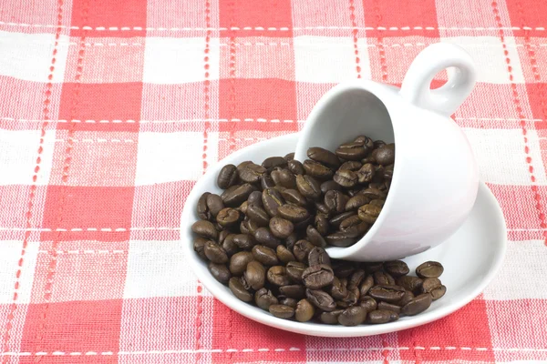 Xícara de café e grãos de café — Fotografia de Stock