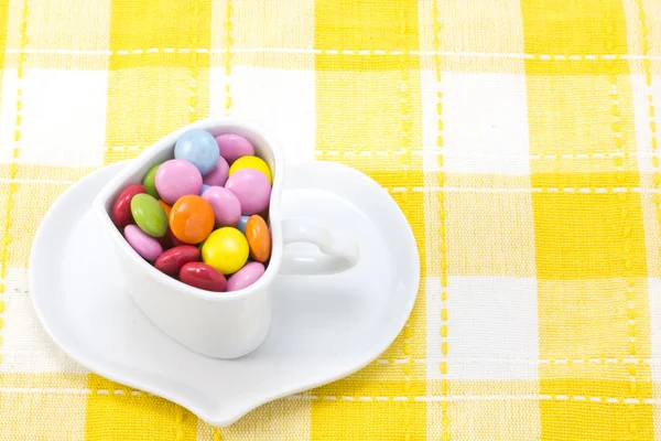 Kleurrijke chocolade en koffiekopje — Stockfoto