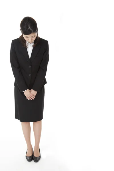 Mujer de negocios que tiene un arco — Foto de Stock