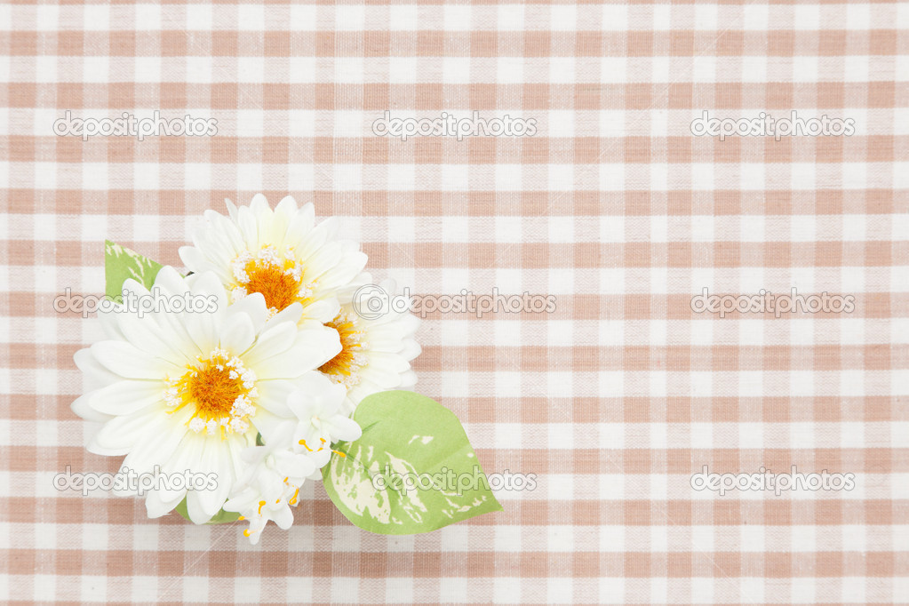 white artificial flowers on the table cloth