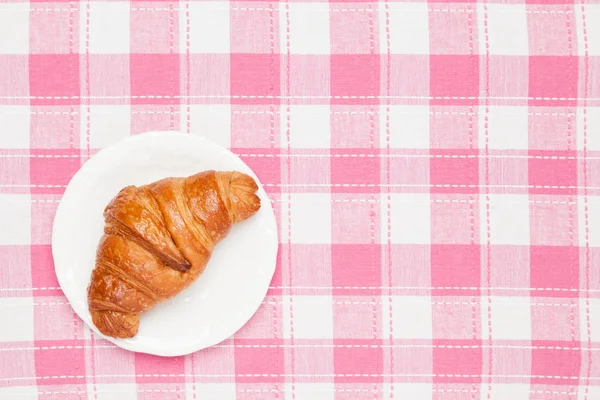 Croissant na toalha de mesa — Fotografia de Stock