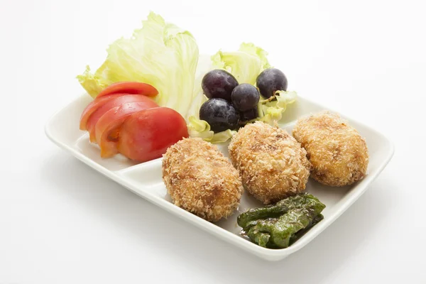 Garnish and croquettes — Stock Photo, Image