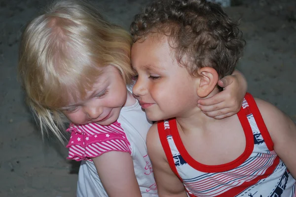 The girl strongly embraces the boy. — Stock Photo, Image