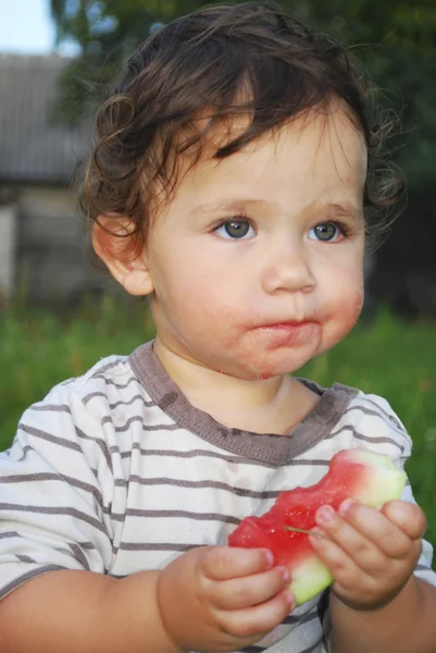 Little girl eats watermelon. — Stock Photo, Image