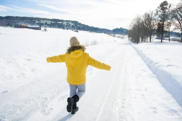 Winter Bright Sunny Day Little Girl Yellow Jacket Walks Snowy — Stock Photo, Image