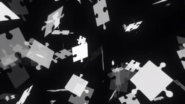 黒と白のパズルピースが落ちる ジグソーのタイルがバラバラになり 4Kループの背景 ストック映像