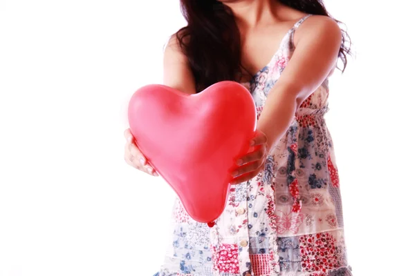 Girl holding heart shape balloon — Stock Photo, Image