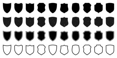 Çeşitli eski model kalkan simgelerinden oluşan bir set. Grunge desenli siyah hanedan kalkanları. Koruma ve güvenlik sembolü, etiket. Vektör illüstrasyonu.