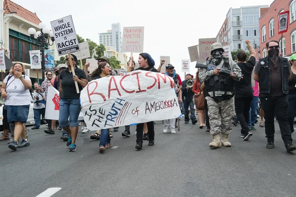 Protesters carried placards in support Trayvon and other victims of violence. — Stock Photo, Image