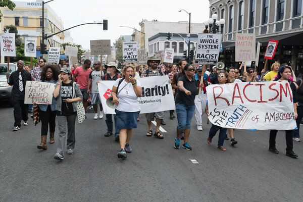 Protesters carried placards in support Trayvon and other victims of violence.