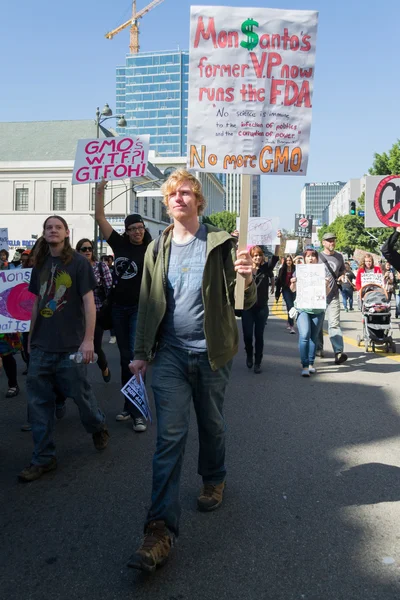 Protesters rallied in the streets against the Monsanto corporation. — Stock Photo, Image