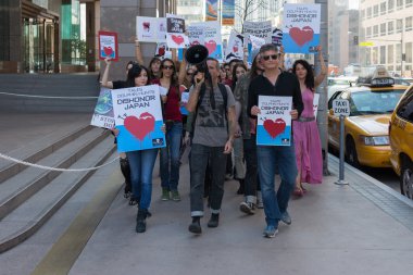 Activists in front of the consulate of Japan in Los Angeles to protest the dolphins slaughter in Taiji. clipart