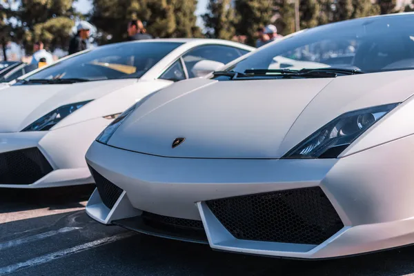 White Lamborghini on exhibition parking at an annual event Super — Stock Photo, Image