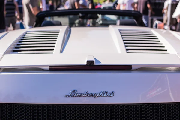 White Lamborghini on exhibition parking at an annual event Super — Stock Photo, Image