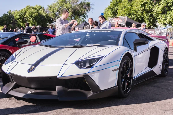 White Lamborghini on exhibition parking at an annual event Super — Stock Photo, Image