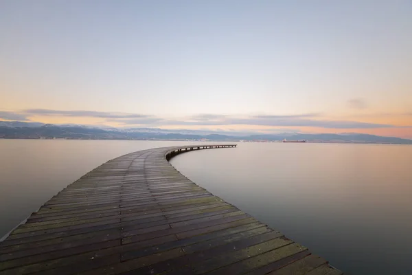 Boomerang Shaped Pier Sea Photographed Long Exposure Technique — Stock Photo, Image