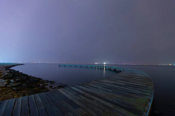 Boomerang Shaped Pier Photographed Using Long Exposure Technique — Foto Stock