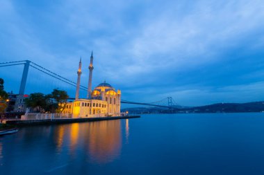 Istanbul. Image of Ortakoy Mosque with Bosphorus Bridge in Istanbul during beautiful sunrise.