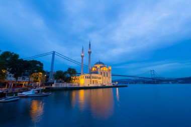 Istanbul. Image of Ortakoy Mosque with Bosphorus Bridge in Istanbul during beautiful sunrise.