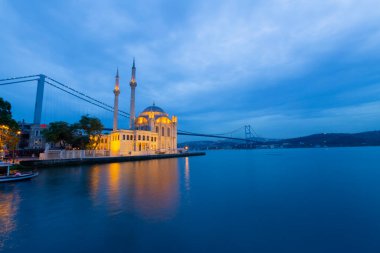Istanbul. Image of Ortakoy Mosque with Bosphorus Bridge in Istanbul during beautiful sunrise.