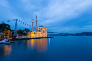 Istanbul. Image of Ortakoy Mosque with Bosphorus Bridge in Istanbul during beautiful sunrise.