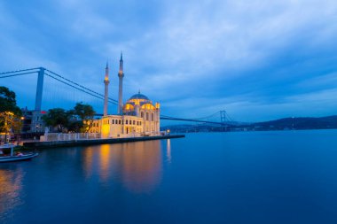 Istanbul. Image of Ortakoy Mosque with Bosphorus Bridge in Istanbul during beautiful sunrise.