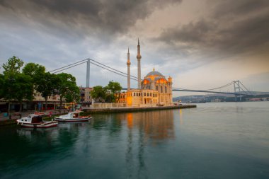 Istanbul. Image of Ortakoy Mosque with Bosphorus Bridge in Istanbul during beautiful sunrise.