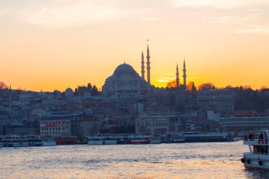 Sunset in Istanbul, Turkey with Suleymaniye Mosque (Ottoman imperial mosque). View from Galata Bridge in Istanbul. clipart