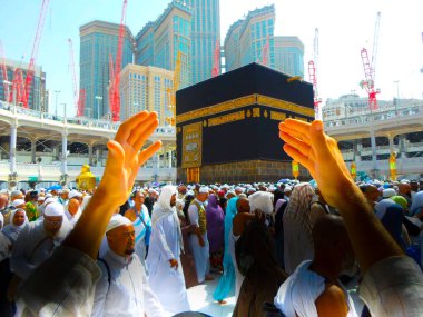 Mecca Saudi Arabia. Muslim people praying together at holy place.