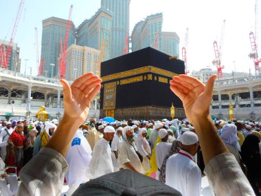 Mecca Saudi Arabia. Muslim people praying together at holy place.