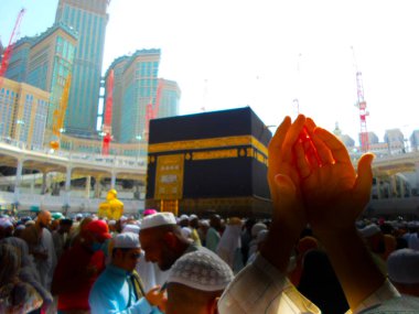 Mecca Saudi Arabia. Muslim people praying together at holy place.