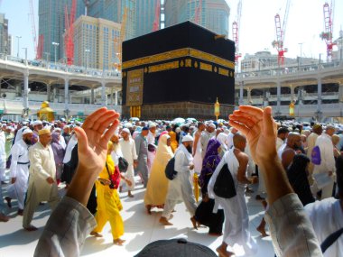 Mecca Saudi Arabia. Muslim people praying together at holy place.