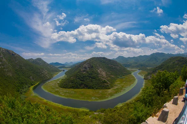 stock image View of the western tip of Lake Skadar, Montenegro. Crnojevic river bend around green mountain peaks. Great view of the river.