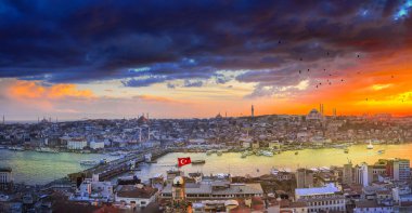 The Galata tower and the old quarters of Istanbul on the background of dark sky. Istanbul before the storm. Tourist destination Istanbul Turkey