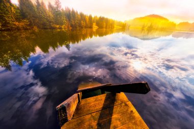 Amazing mountain pond on the Geroldsee lake (Wagenbrchsee), in the background overlooking the Alpspitz and Zugspitz mountains at sunset, Garmisch-Partenkirchen, Bavaria in Germany