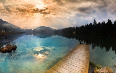 Amazing mountain pond on the Geroldsee lake (Wagenbrchsee), in the background overlooking the Alpspitz and Zugspitz mountains at sunset, Garmisch-Partenkirchen, Bavaria in Germany